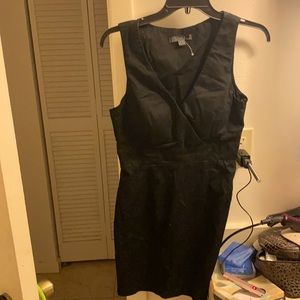 Sleeveless black ladies mini dress. Zippers down the side